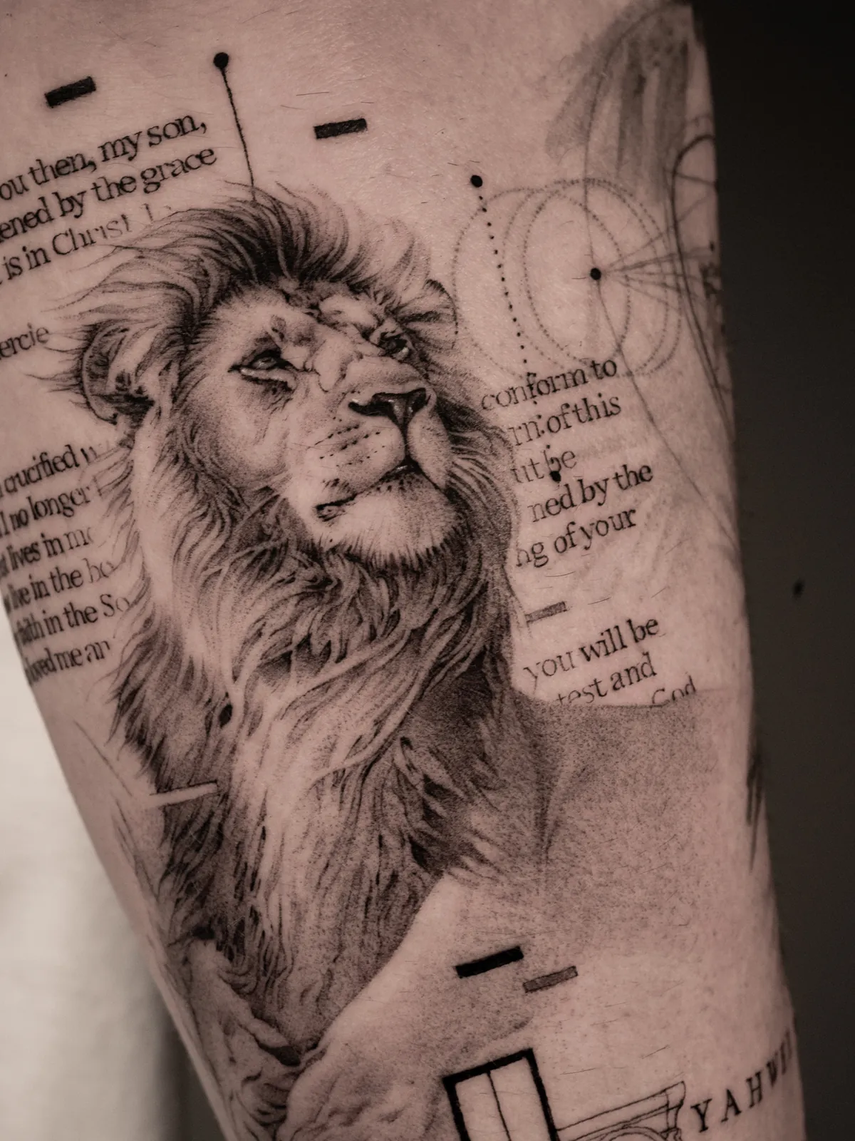 Lion & Scripture — tattoo by Ted Faulmann